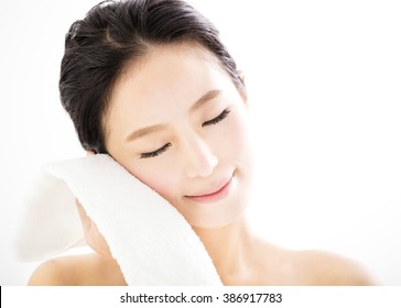 Young Woman Cleaning Her Face With  Towel