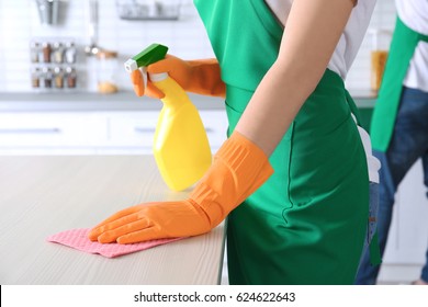 Young Woman Cleaning Kitchen Table, Closeup