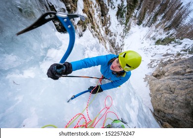 Young Woman Climbing The Icefall