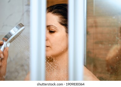 Young Woman With Closed Eyes Take A Shower At Home. Domestic Portrait.