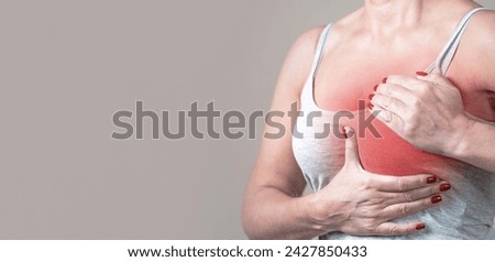 The young woman clutched her sternum. Angina attack, heart disease.