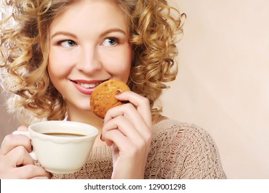 young  woman with coffee and cookies