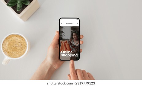 Young woman with coffee cup using cellphone for online shopping on table, top view. Lady ordering purchases with app or website, fashion store on screen, sale for shopaholic - Powered by Shutterstock