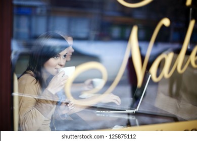 Young Woman In Coffee Shop