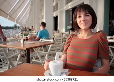 Young Woman In Coffee Shop