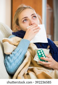 Young Woman With Cold And Blocked Nose At Home