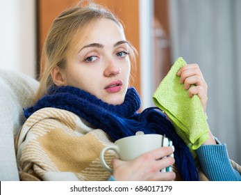 Young Woman With Cold And Blocked Nose At Home