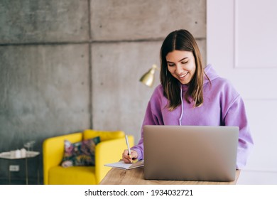 Young Woman College Student Studying With Laptop, Distantly Preparing For Test Exam, Writing Essay Doing Homework At Home, Distantly Education Concept.