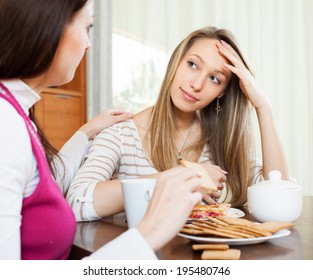 Young Woman Comforting Depressed Friend Table Stock Photo 195480746 ...