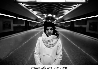 Young Woman Commuter In Subway Metro Station Alone At Night,pensive Thinking Lost Woman Doesn't Know Where To Go.Running Away,leaving Town.Danger,scared Woman.Robbed,abused Woman.Toned,noise Added