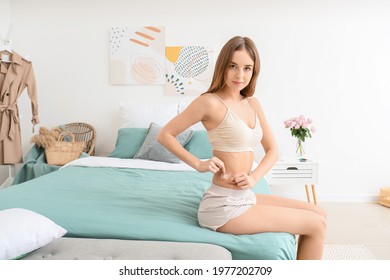 Young Woman With Contraceptive Patch In Bedroom