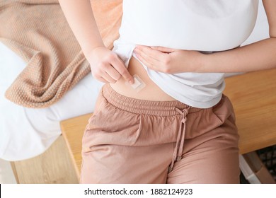 Young Woman With Contraceptive Patch At Home