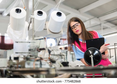 Young woman controlling automated production of textile thread and cotton spinning - Powered by Shutterstock