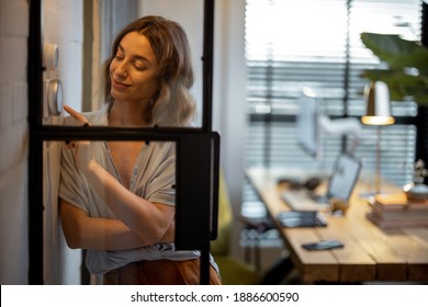 Young Woman Controlling Room Temperature With A Smart Thermostat At Home. Home Comfort And Smart Heating System Concept