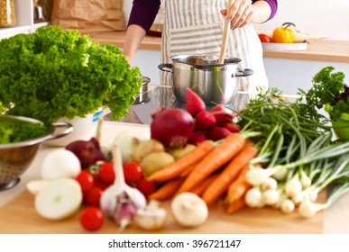 Young Woman Cooking In The Kitchen. Healthy Food