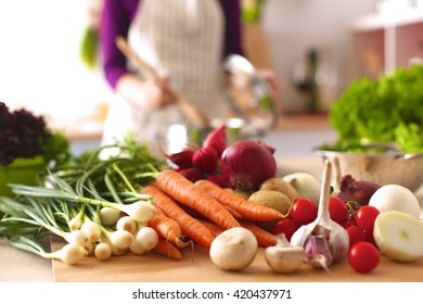 Young Woman Cooking in the kitchen. Healthy Food