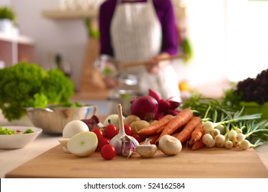 Young Woman Cooking In The Kitchen. Healthy Food