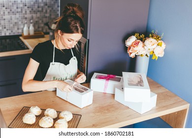 Young Woman Cooking On Home Kithen. Preparation Pastry Dessert. Homemade Pastry. Small Business
