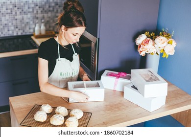 Young Woman Cooking On Home Kithen. Preparation Pastry Dessert. Homemade Pastry. Small Business
