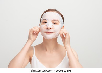 young woman in cosmetic mask on face