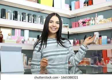 Young Woman At Counter In Perfume Shop