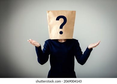 Young Woman Covered Bag Her Face With Question Marks Icon, Customer Confuses, Unclear Marketing Strategy, Communication Breakdown.