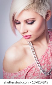 A Young Woman With Creative Hair Style And A 1980s Look. Pink Toned.