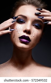Young woman and creative makeup   bright lips marsala color  Beautiful model and dark painted nails  The beauty the face 