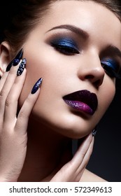 Young woman and creative makeup   bright lips marsala color  Beautiful model and dark painted nails  The beauty the face 