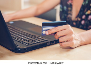 Young Woman With A Credit Card Is Shopping Online In The Office. Blackfriday And Cybermonday Concept. 