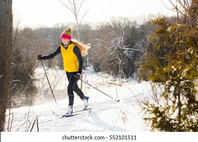 A Young Woman Cross Country Skiing In Ontario, Canada. 