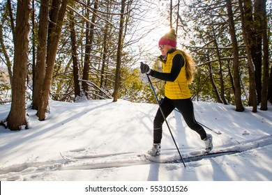 A young woman cross country skiing in Ontario, Canada. 