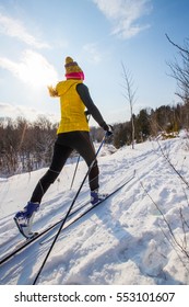 A young woman cross country skiing in Ontario, Canada. 