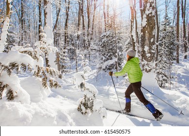 A Young Woman Cross Country Skiing In Ontario, Canada.