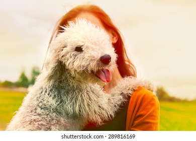 Young Woman Cuddling Her Dog