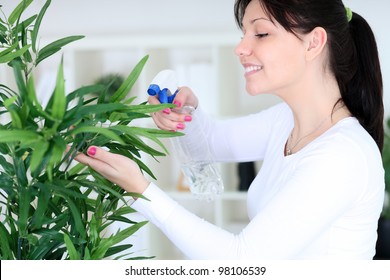 Young woman cultivating flowers - Powered by Shutterstock