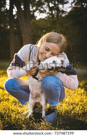 Similar – Happy smiling dog with its pretty young owner