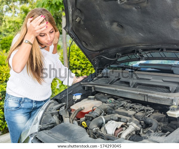 Young Woman with Damaged\
Car