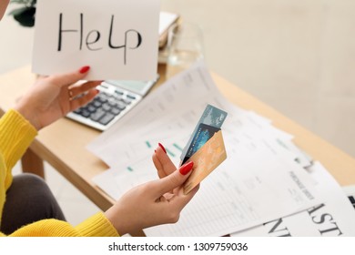 Young woman in debt at home - Shutterstock ID 1309759036