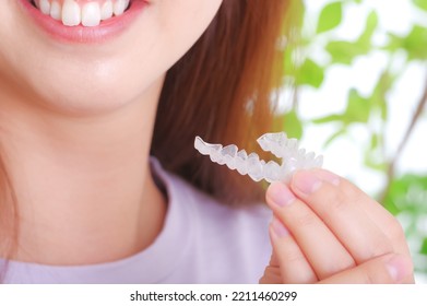 Young woman with dental mouthpiece
