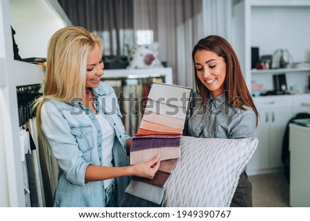 Similar – Image, Stock Photo Young woman crafting with paper at a creative workspace