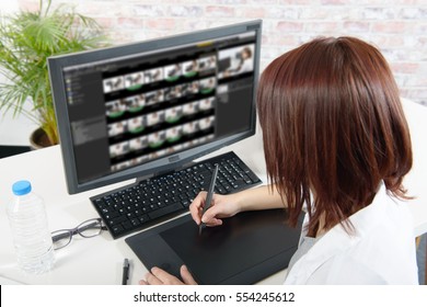 Young  Woman Designer Using Computer For The Video Editing