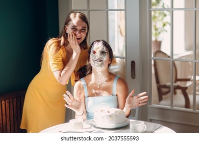 Young Woman Dips Face In White Cake With Cream. Happy Fun Birthday Concept