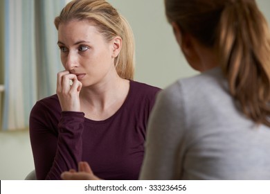 Young Woman Discussing Problems With Counselor - Shutterstock ID 333236456