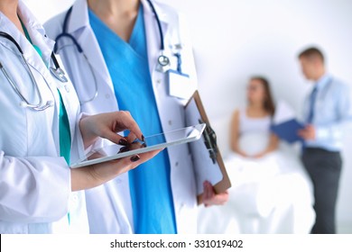 Young woman  doctor holding a tablet pc - Shutterstock ID 331019402