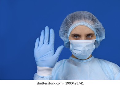 Young Woman Doctor Or Nurse Shows A Stop Gesture With Her Hand