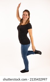 An Young Woman Is Doing A Cross Crawl Exercise. This Is An Exercise From The Brain Gym To Improve Learning And Concentration. Isolated With White Background.