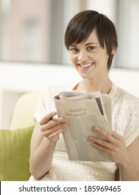 Young Woman Doing Crossword Puzzle