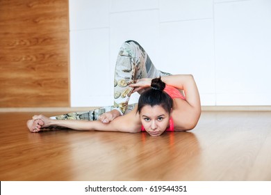 Young Woman Doing A Difficult Yoga Pose