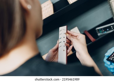 Young Woman Doing Ear Piercing At Beauty Studio Salon